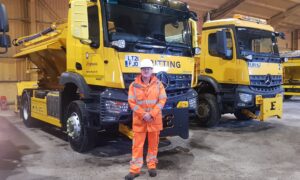 Trevor Bayfield standing in front of a lorry