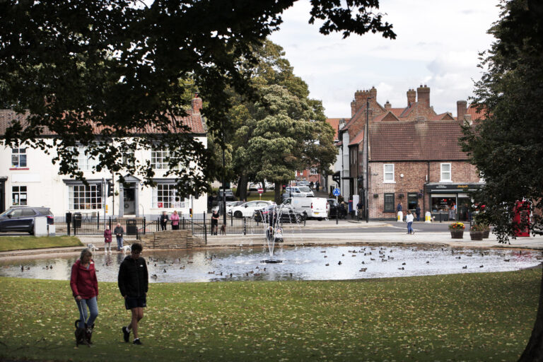 People walking around at Norton duck pond