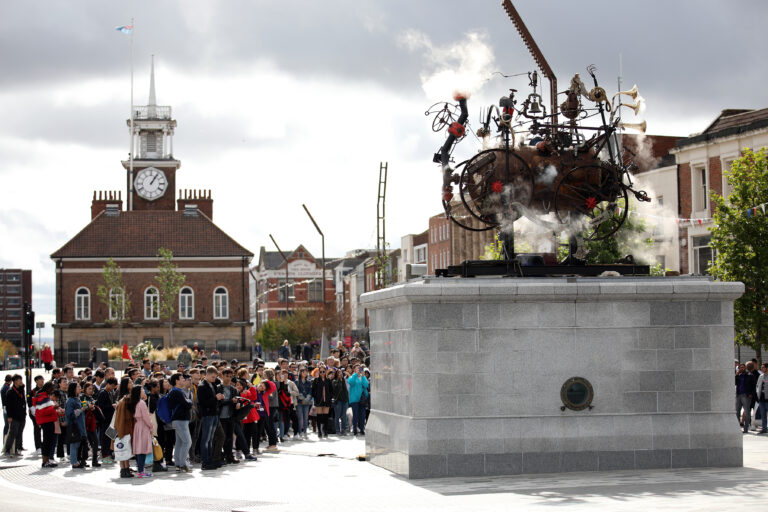 People looking at sculpture