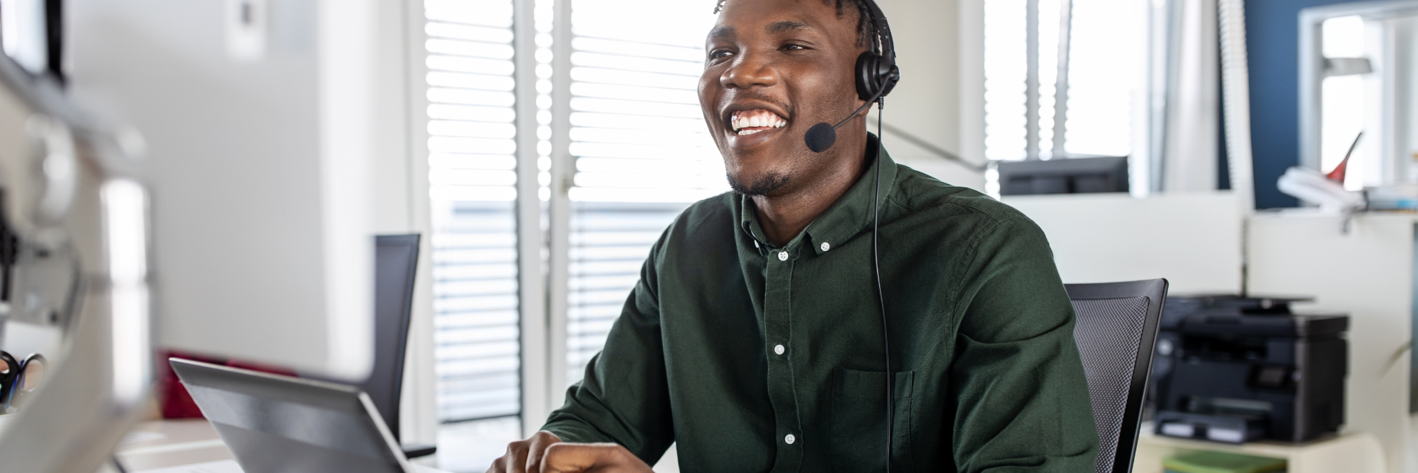 Man smiling while on internet call - Yorkshire and Humber Regional and International recruitment hub