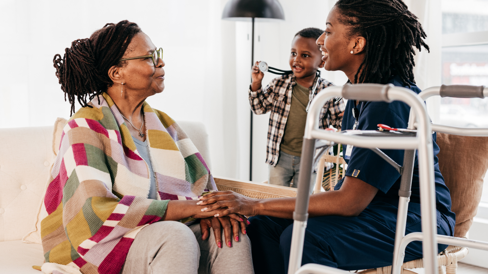 Social worker at home with patient