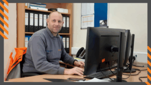 Ross Turner working at a computer at NY Highways