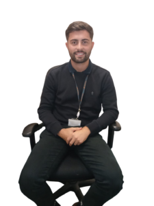 Luka Jobson sat on chair with white background