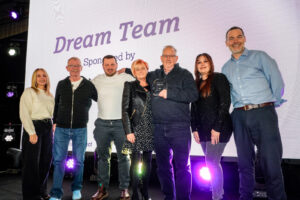 YPO team - winning an award - 5 people on stage
