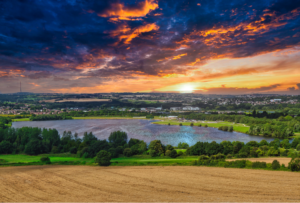 Pugneys country park at sunset with blue lake in the middle